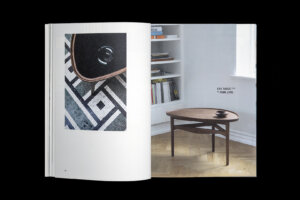 House of Finn Juhl catalogue spread pairing a tabletop detail with a round wooden coffee table in a bright interior.