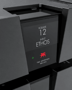 Close-up of the Gryphon Helios front display with volume and input settings, a red griffin logo and white lettering.