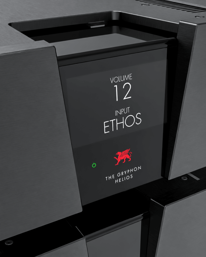 Close-up of the Gryphon Helios front display with volume and input settings, a red griffin logo and white lettering.