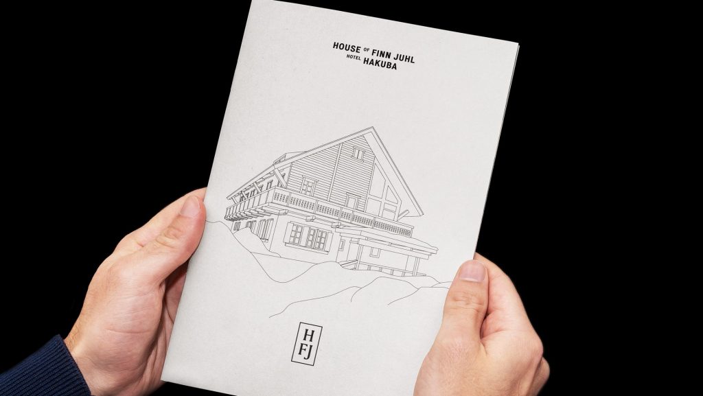 House of Finn Juhl catalogue held in a hand