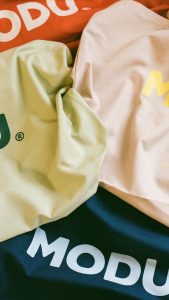 MODU branded bags with playful graphic patterns